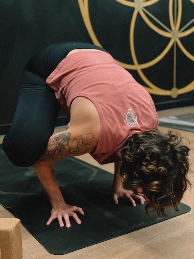 To show a student taking a precision STRONG yoga class.