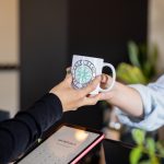 Guest receiving a Precision Wellness mug at check-in, creating a warm and welcoming first visit experience.