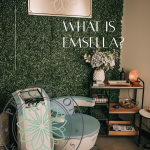 EmSella treatment room at Precision Wellness with branded greenery wall, treatment chair, and “What Is EmSella?” text overlay.