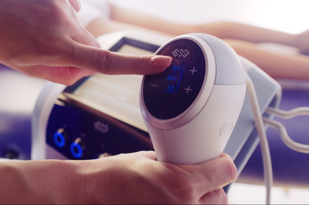 BTL body contouring device being adjusted during a non-invasive treatment at Precision Wellness in Springfield, MO.